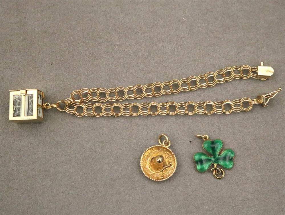 14K YELLOW GOLD TRIPLE-ROUND-LINK FLEXIBLE BRACELET WITH THREE ASSORTED 14K YELLOW GOLD CHARMS. (1 of 18)