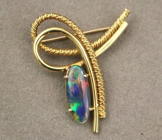 18K YELLOW GOLD AND BLACK OPAL DOUBLET CONTEMPORARY LOOP DESIGN PIN.