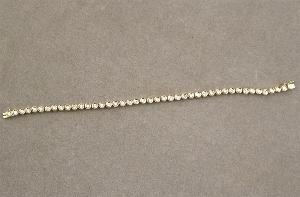 14K YELLOW GOLD AND DIAMOND TENNIS BRACELET. - L: 7 3/8 in. Gross wt.: 10 dwt. (1 of 13)