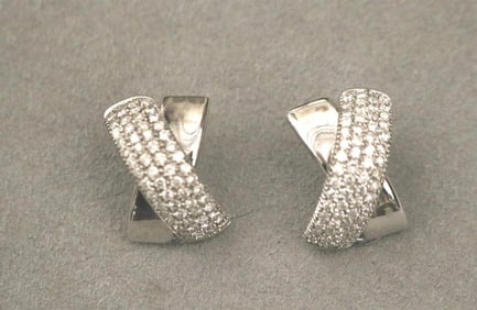 PAIR 18K (750) WHITE GOLD AND DIAMOND DOMED X-FORM CLIP-BACK EARRINGS. - L: 15/16". Gross wt.: 8