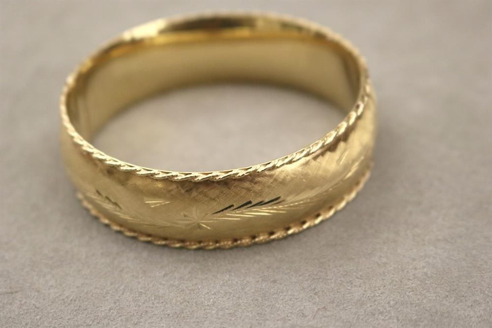 14K TEXTURED YELLOW GOLD HINGED OVAL BANGLE BRACELET. - W: 3/4 in.  Wt.: 18 dwt. (1 of 13)