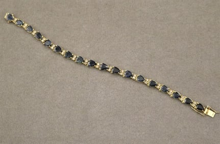 14K YELLOW GOLD, DIAMOND AND SAPPHIRE FLEXIBLE-LINK BRACELET. - L: 7 1/4 in. W: 1/4 in. Gross wt. 10