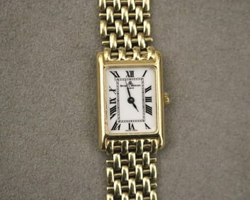 LADY'S BAUME & MERCIER 14K YELLOW GOLD WRISTWATCH.