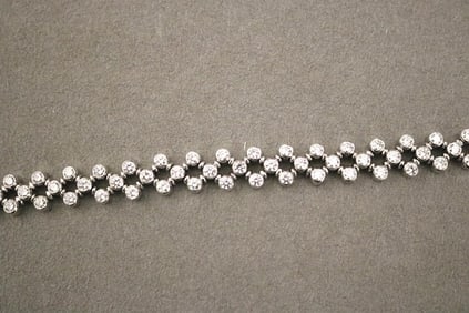 GERMAN 18K (750) WHITE GOLD AND DIAMOND FLEXIBLE LINK BRACELET.