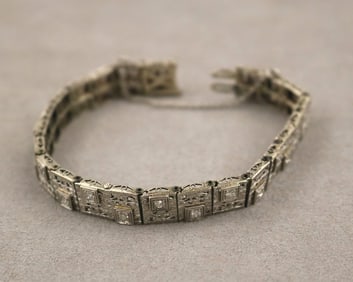 14K WHITE GOLD AND DIAMOND FLEXIBLE PANEL-LINK BRACELET. early 20th century