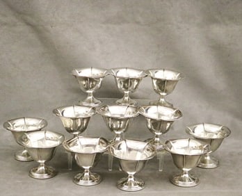 SET OF 12 WEIGHTED STERLING SILVER SHERBET CUPS.