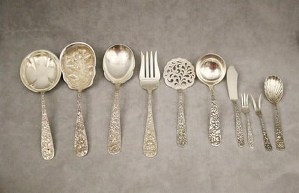TEN ASSORTED FLORAL REPOUSSE STERLING SILVER SERVING UTENSILS BY VARIOUS MAKERS. - Wt.: 23.6 troy