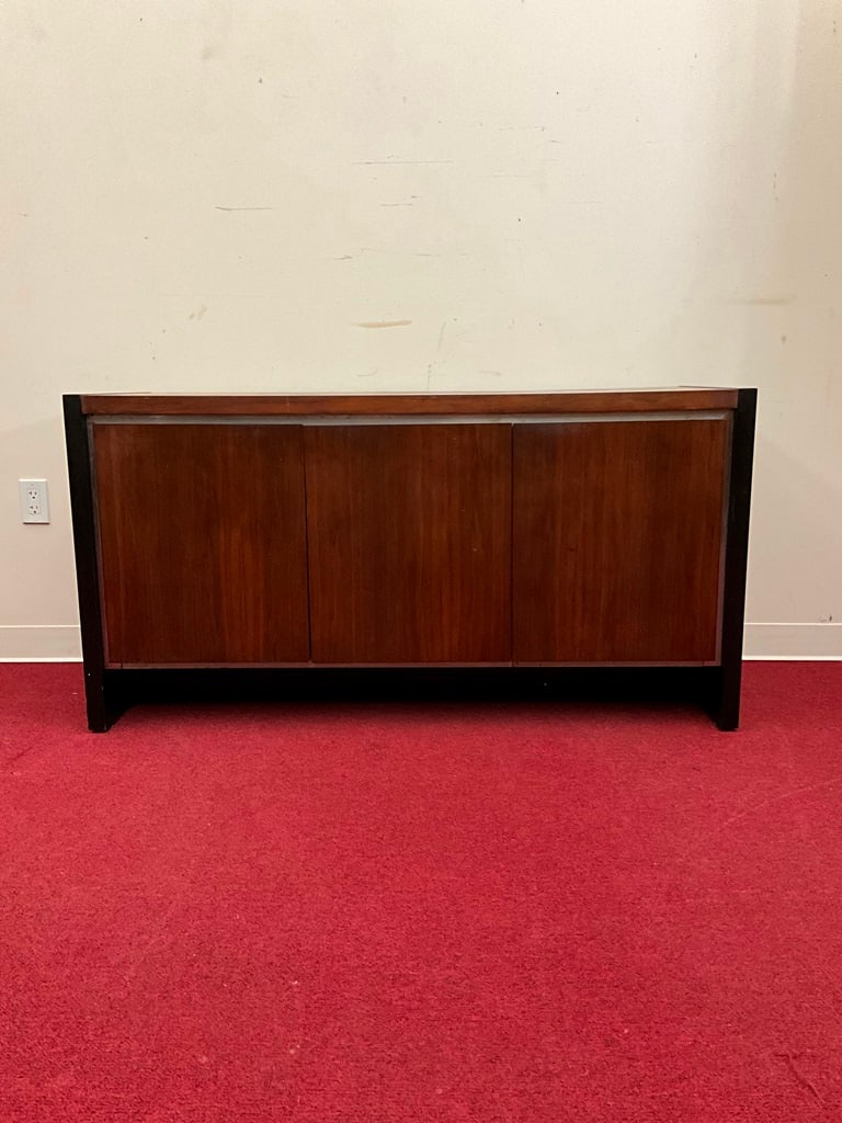 MID-CENTURY MODERN WALNUT, THREE-DRAWER SIDEBOARD WITH DILLINGHAM LABEL. Doors open to drawer,: MID-CENTURY MODERN WALNUT, THREE-DRAWER SIDEBOARD WITH DILLINGHAM LABEL. Doors open to drawer, shelves and open compartment - H: 29 1/2 in.; W: 56 1/2 in.; D: 19 in.