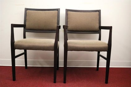 SET OF FOUR MID-CENTURY MODERN ROSEWOOD OPEN-ARM DINING CHAIRS. Back panels and seats covered in