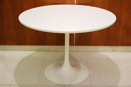 MID-CENTURY MODERN EERO SAARINEN DESIGN WHITE TULIP TABLE. Heavy enameled base; white wooden top.