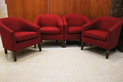SET OF FOUR CONTEMPORARY CRANBERRY COLOR UPHOLSTERED BARREL-BACK ARM CHAIRS.