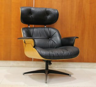 1960S BLACK LEATHER UPHOLSTERED EAMES CHAIR WITH MATCHING FOOT STOOL.