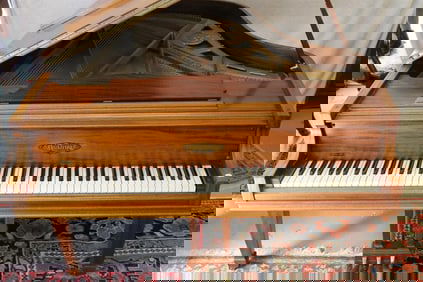 CHICKERING LIGHT MAHOGANY BABY GRAND PIANO WITH NEEDLEPOINT COVERED SEAT.
