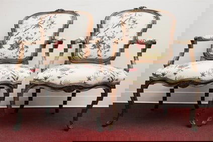 SET FOUR LOUIS XV CARVED FRUITWOOD UPHOLSTERED FAUTEUILS EN CABRIOLE. Floral crests; floral cotton