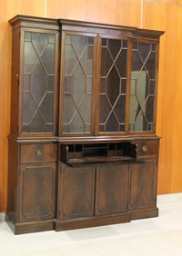 GEORGE III STYLE MAHOGANY BREAKFRONT WITH CENTRAL DRAWER FITTED AS WRITING COMPARTMENT. - H: 84 in.