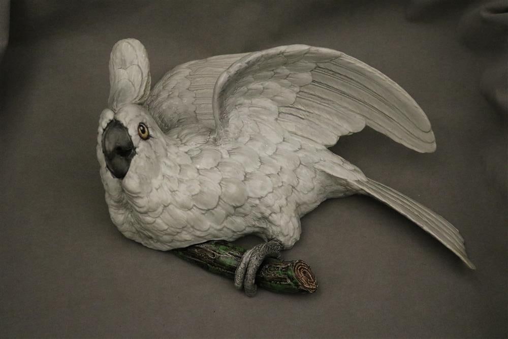 PAINTED CERAMIC WALL POCKET MODELED AS FIGURE OF WHITE BIRD PERCHED ON BRANCH IN STYLE OF MEISSEN. (1 of 12)