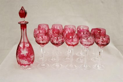 15-PIECE ASSEMBLED SET OF CRANBERRY-TO-COLORLESS CUT CRYSTAL HOCH GLASSES WITH DROP-SHAPE DECANTER.
