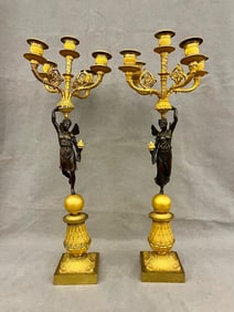 PAIR FRENCH BRONZE AND GILT-BRONZE FIGURAL FIVE-LIGHT CANDELABRAS, 19th century. - H: 24 in.