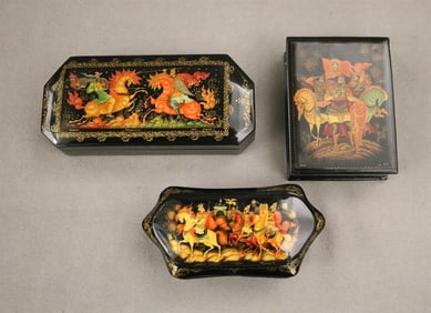 THREE ASSORTED RUSSIAN PAINTED BLACK LACQUER FAIRYTALE BOXES. - Largest, 6 1/ 2 in.