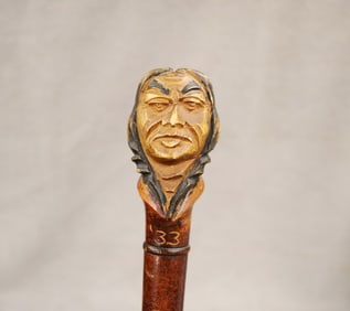 DARTMOUTH COLLEGE HAND-CARVED WOODEN INDIAN CANE, CLASS OF '33. - L: 36".