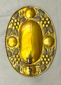 DUTCH REPOUSSE OVAL CANDLE SCONCE EMBOSSED WITH FRUIT AND FLOWERS, late 18th century.