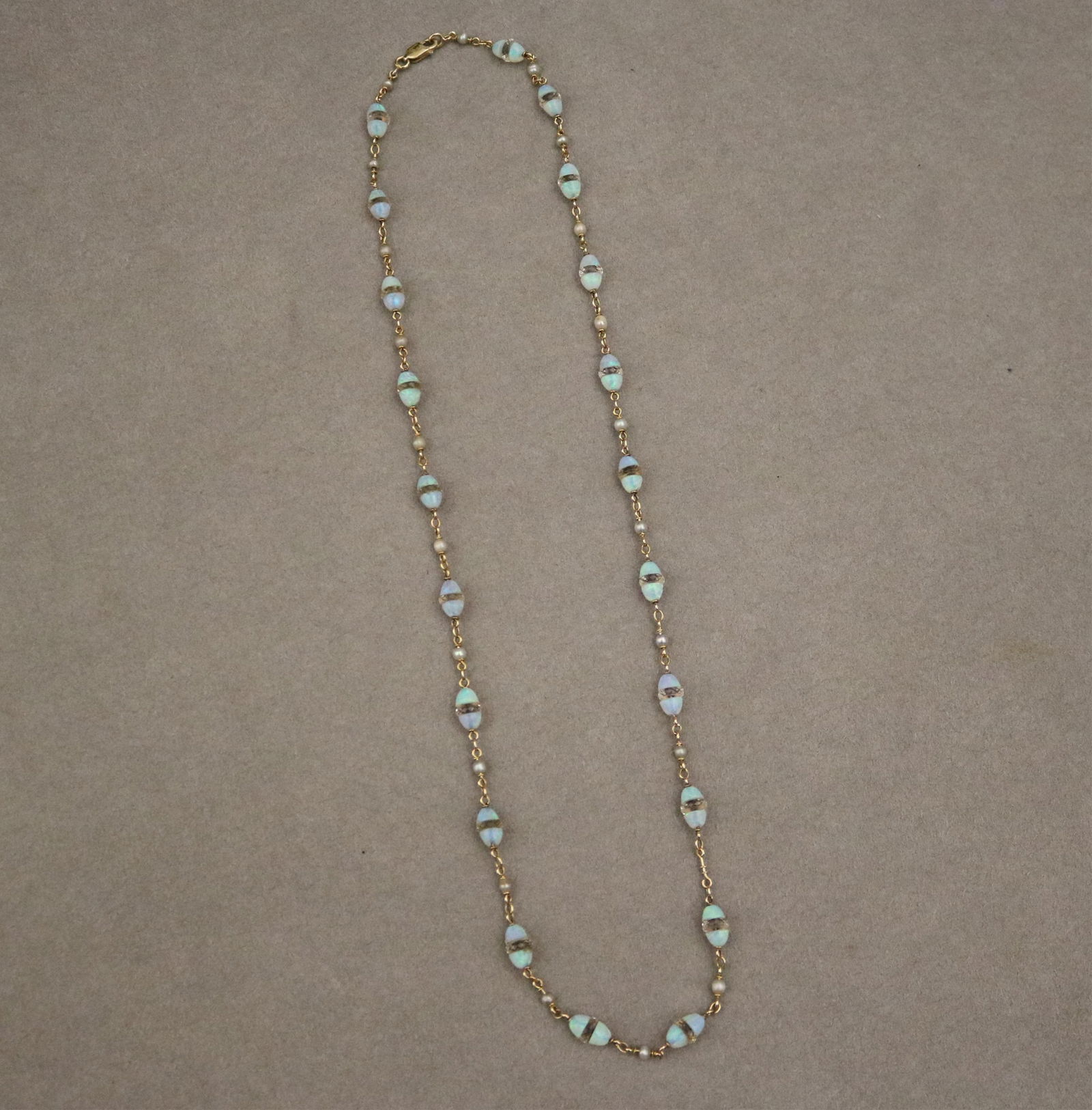 14K YELLOW GOLD, CULTURED PEARL, PRECIOUS WHITE OPAL AND COLORLESS CRYSTAL ROUNDEL FLEXIBLE LINK: 14K YELLOW GOLD, CULTURED PEARL, PRECIOUS WHITE OPAL AND COLORLESS CRYSTAL ROUNDEL FLEXIBLE LINK CHOKERRound-link chain spaced with twenty-one 2.5mm pearls and twenty-one oval beads constructed of bis