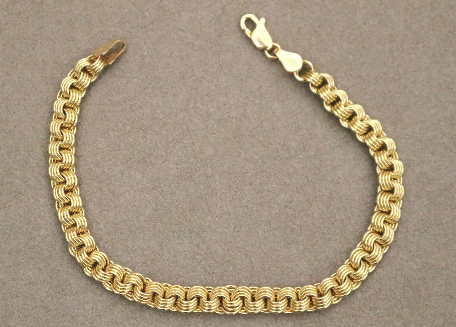 14K YELLOW GOLD ROUND LINK FLEXIBLE CHAIN BRACELET. (1 of 10)