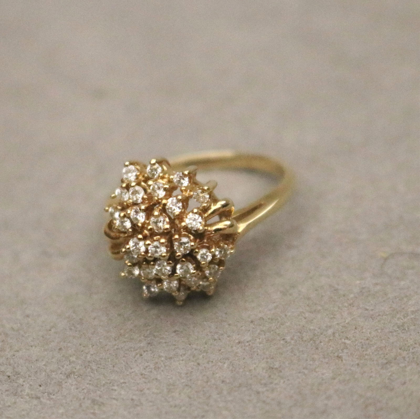14K YELLOW GOLD AND DIAMOND CLUSTER RING. Ring size: 6 1/2. Gross wt.: 3 dwt. (1 of 13)