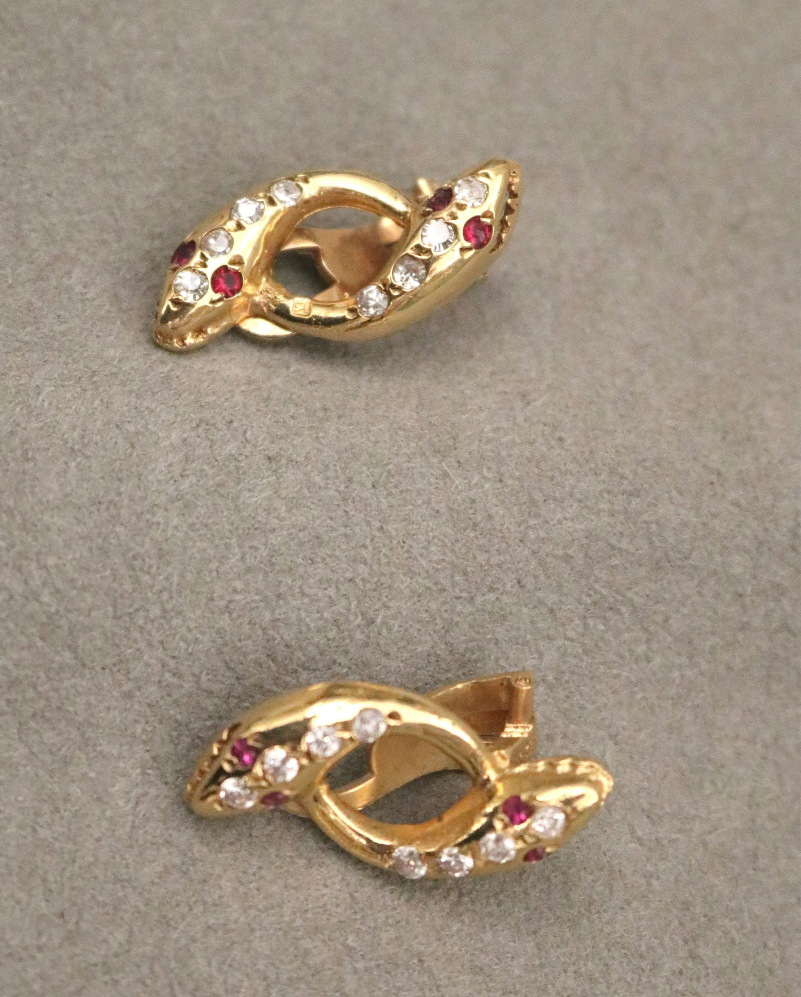 PAIR EGYPTIAN GOLD CLIP-BACK EARRINGS FASHIONED AS DOUBLE-SERPENT HEADS. L: 1??. Wt.: 4 dwt. (1 of 11)
