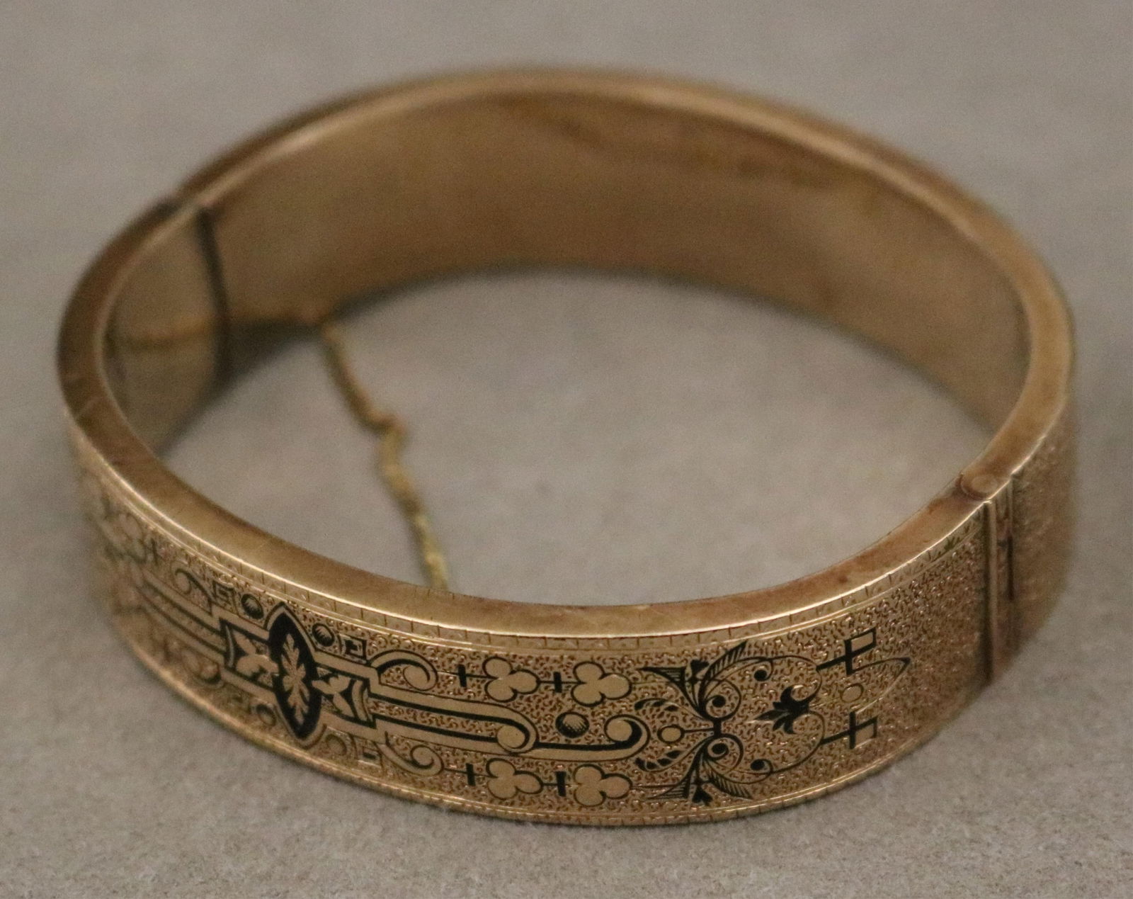 YELLOW GOLD AND BLACK ENAMEL HINGED OVAL BANGLE BRACELET mid-to-late 19th century Overall, 2 3/8 in. (1 of 20)