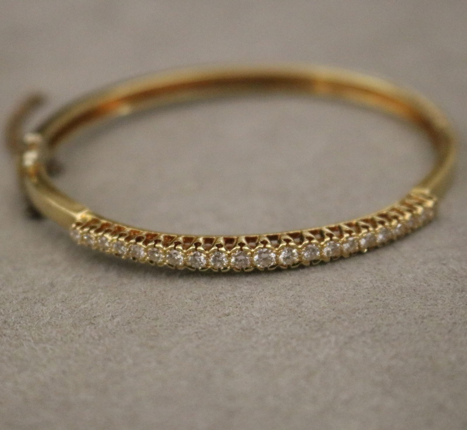 18K BRIGHT-POLISHED YELLOW GOLD AND DIAMOND HINGED OVAL BANGLE BRACELET Overall, 2 1/2 in. x 2 1/4 (1 of 12)