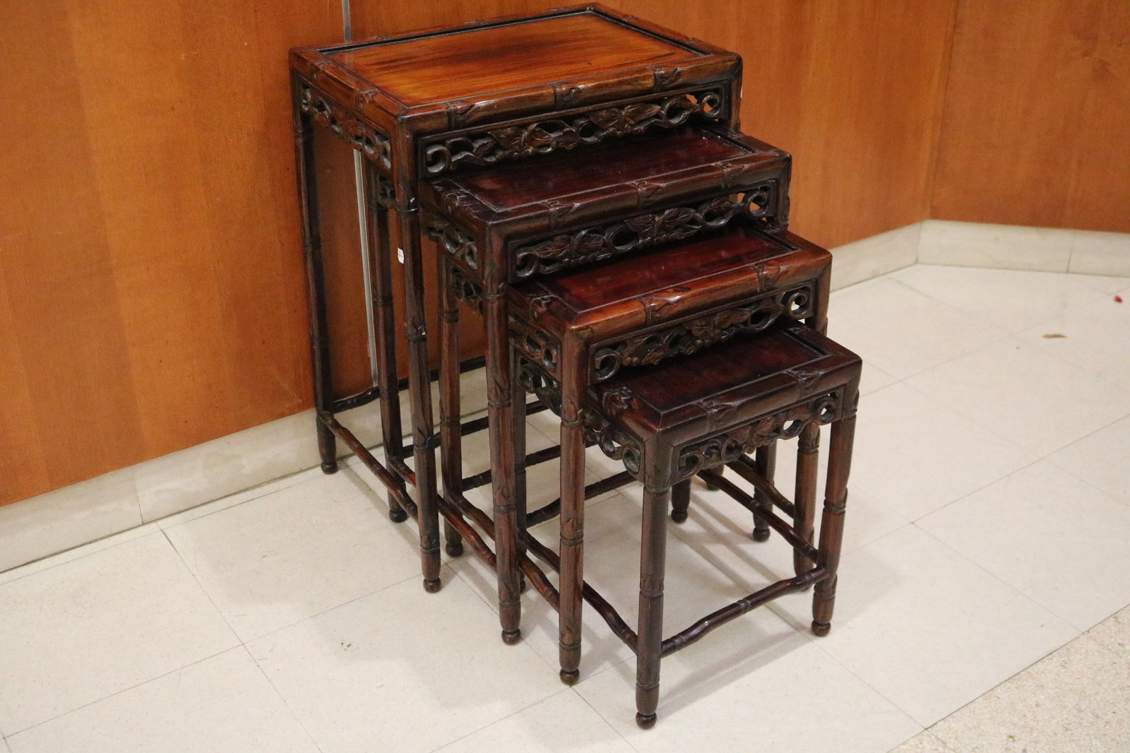 NEST OF FOUR CHINESE CARVED TEAKWOOD STACKING TABLES (1 of 7)