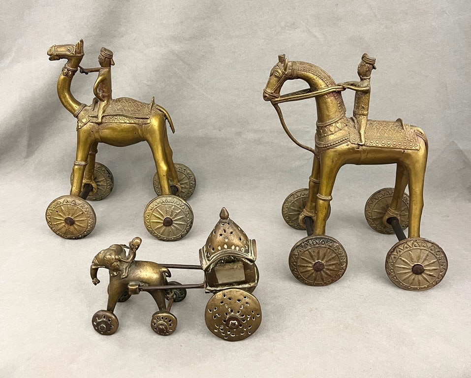 THREE ANTIQUE INDIAN CAST BRASS PULL TOYS. Two, figures on horseback, H: 13 in. One, figure on (1 of 11)