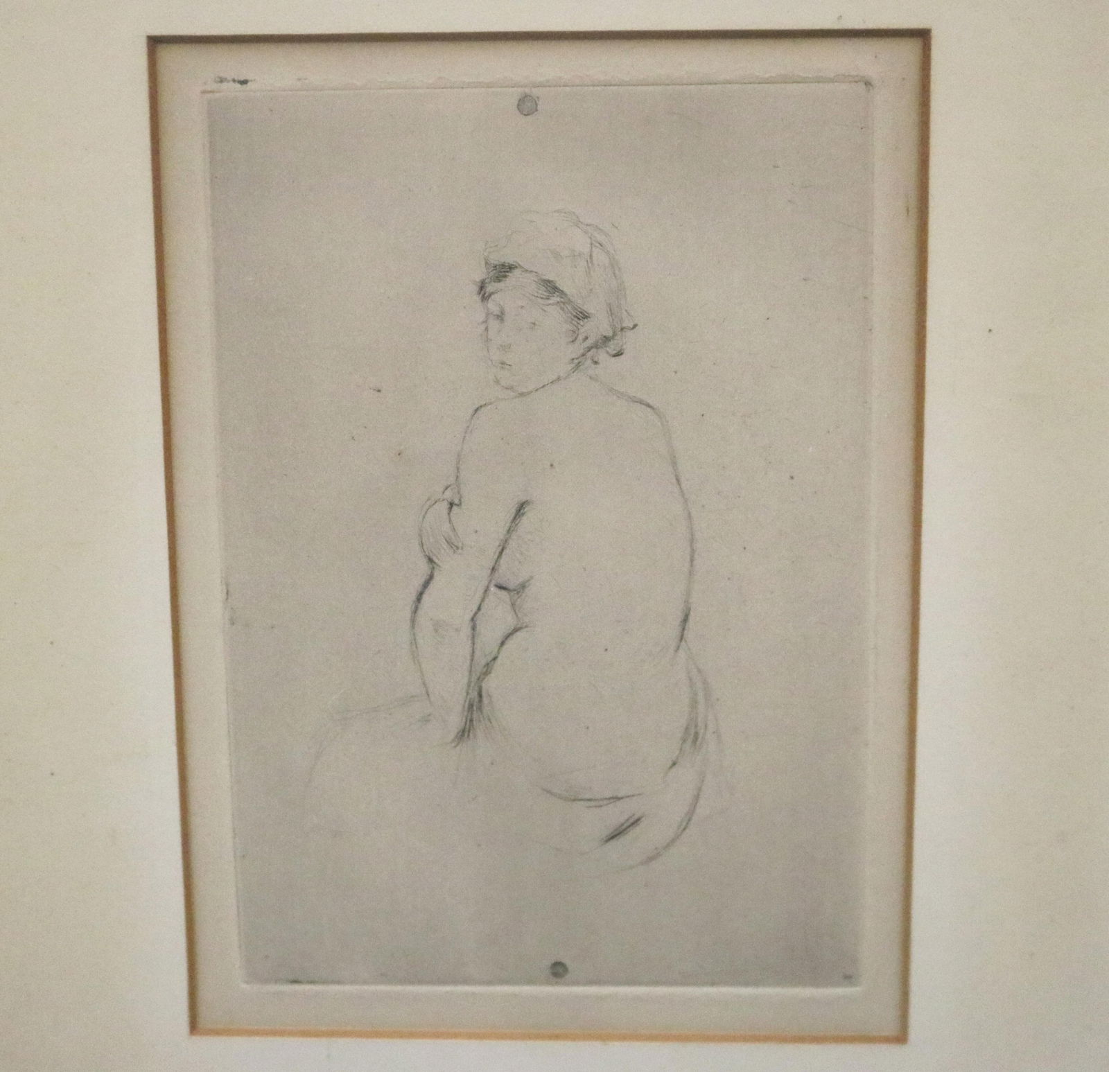Berthe Morisot, French 1841 –1895, Nude, circa 1889, Sight: 5.5 x 3.75 inches; frame: 15.5 x 13.5: BERTHE MORISOTFrench, 1841 –1895Nude, circa 1889Black and white drypoint depicting the back of a seated nude figure, with face turned towards the viewer. Artwork was first etched in 1889; printed an