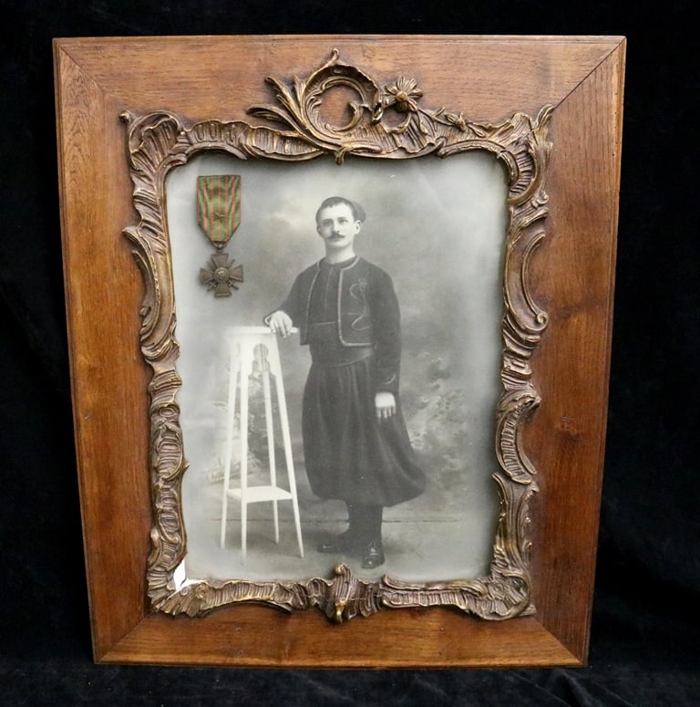 FRENCH SCHOOL (early 20th century). "French Croix de Guerre" (War Cross) Balkan Recipient, Black and: FRENCH SCHOOL (early 20th century). "French Croix de Guerre" (War Cross) Balkan Recipient, Black and white photograph of a man possibly wearing a folk dress from a Balkan or Eastern European country.