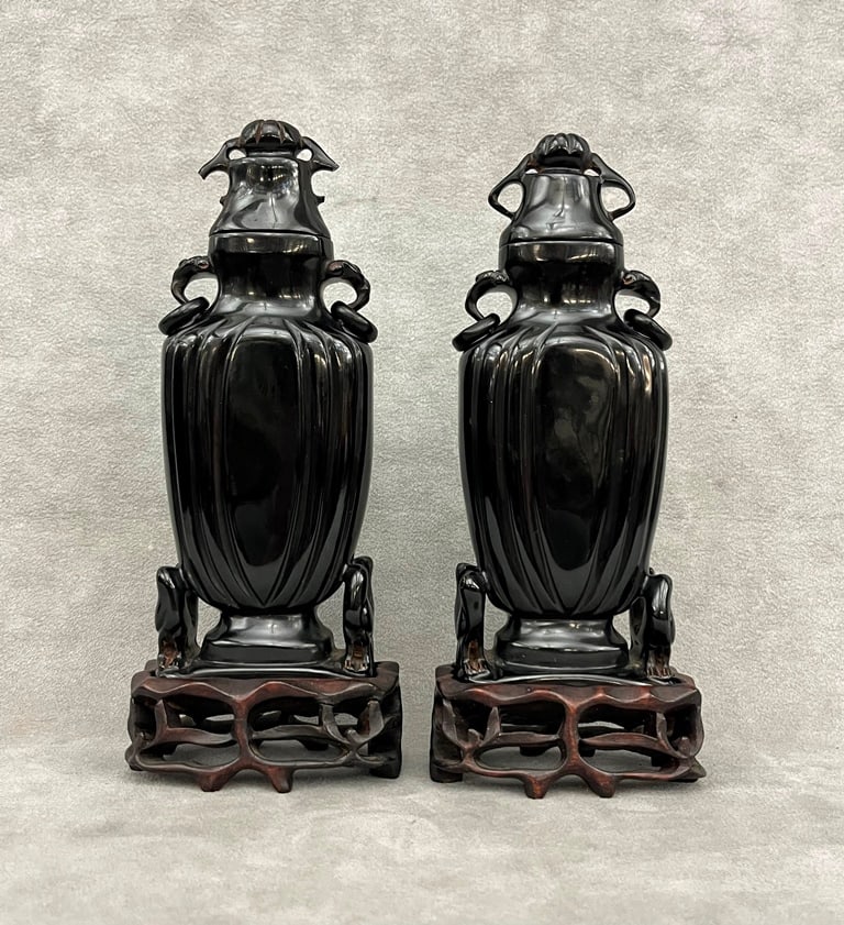 PAIR CHINESE-INSPIRED ART DECO BLACK BAKELITE TWO-HANDLE, LIFT-COVER VASES. Carved teakwood fitted (1 of 9)
