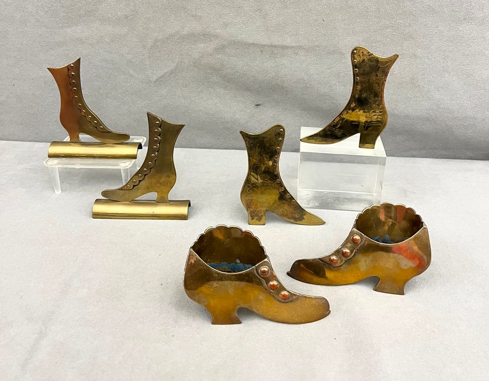 THREE PAIRS BRASS SHOE FORM TABLE-TOP ORNAMENTS. 19th century. Various styles of high-button lady's (1 of 11)