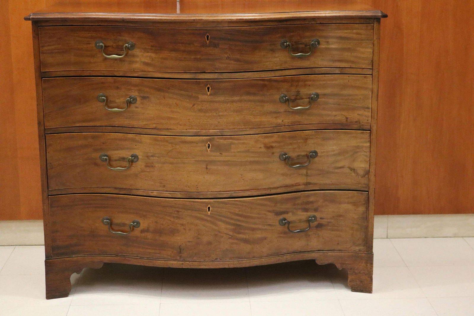 GEORGE III MAHOGANY SERPENTINE-FRONT FOUR-DRAWER CHEST - H: 38 1/2". W: 45 3/4". D: 24".. (1 of 8)