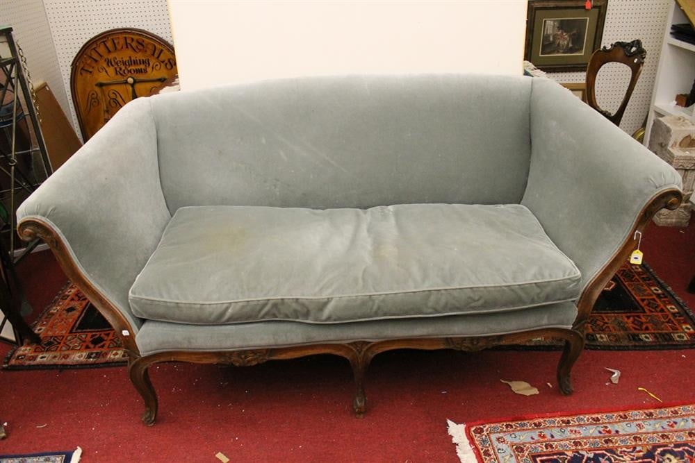 LOUIS XV CARVED OAK, SIX-LEG UPHOLSTERED CANAPE. Flaring sides; cabriole legs; single seat cushion; (1 of 4)