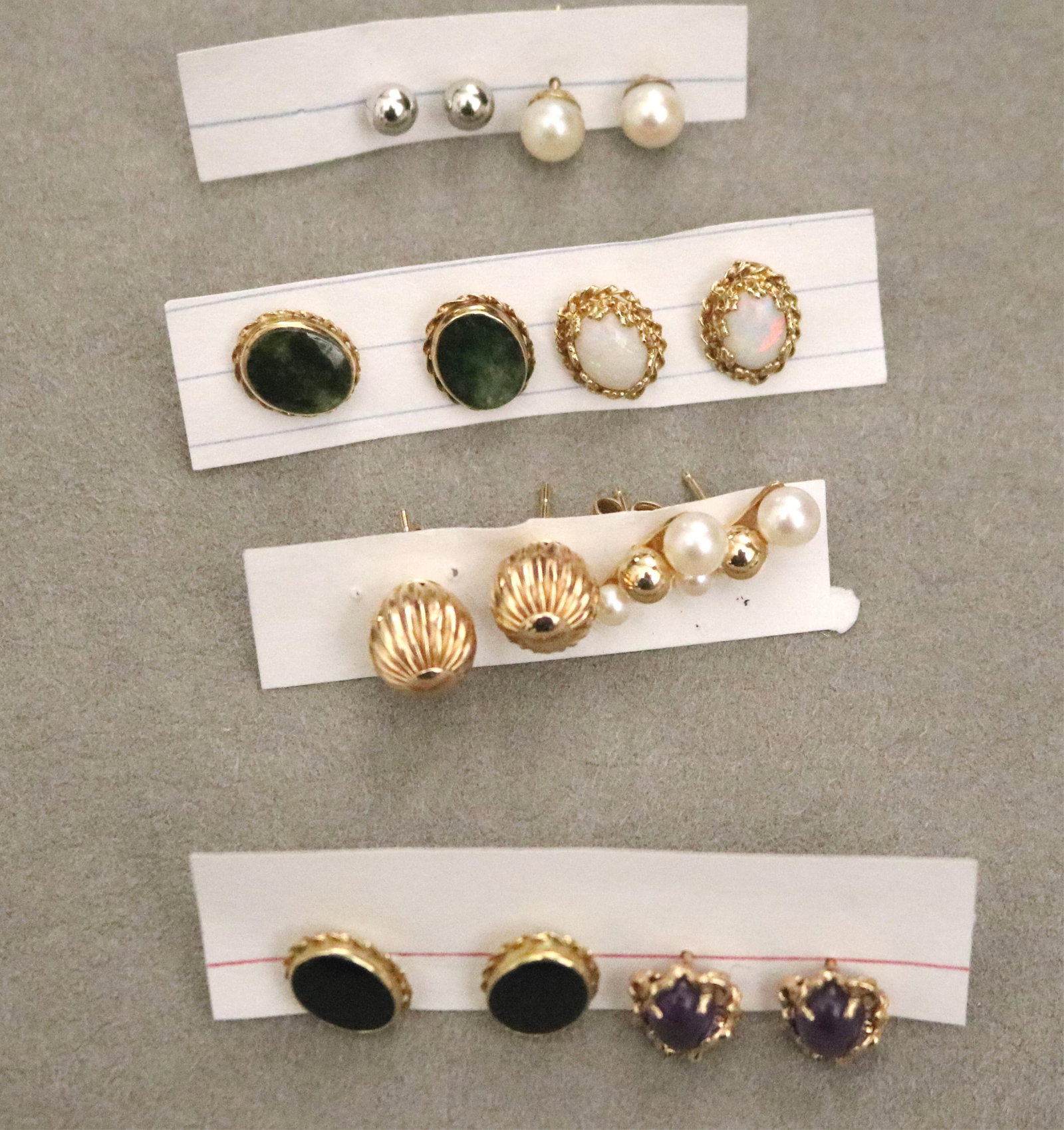 EIGHT ASSORTED PAIRS GEMSTONE AND OTHER STUD EARRINGS - .: EIGHT ASSORTED PAIRS GEMSTONE AND OTHER STUD EARRINGS Including black onyx, precious white opal, amethyst cabochon, cultured pearl, yellow gold and other