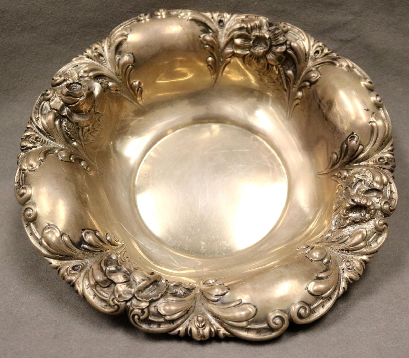 ART NOUVEAU STERLING SILVER SERVING BOWL late 19th-early 20th century - D: 9½". wt.: 10 troy oz..: ART NOUVEAU STERLING SILVER SERVING BOWL late 19th-early 20th century Lobed, out-flaring sides with serpentine outline and high-relief floral decoration. D: 9½". wt.: 10 troy oz.