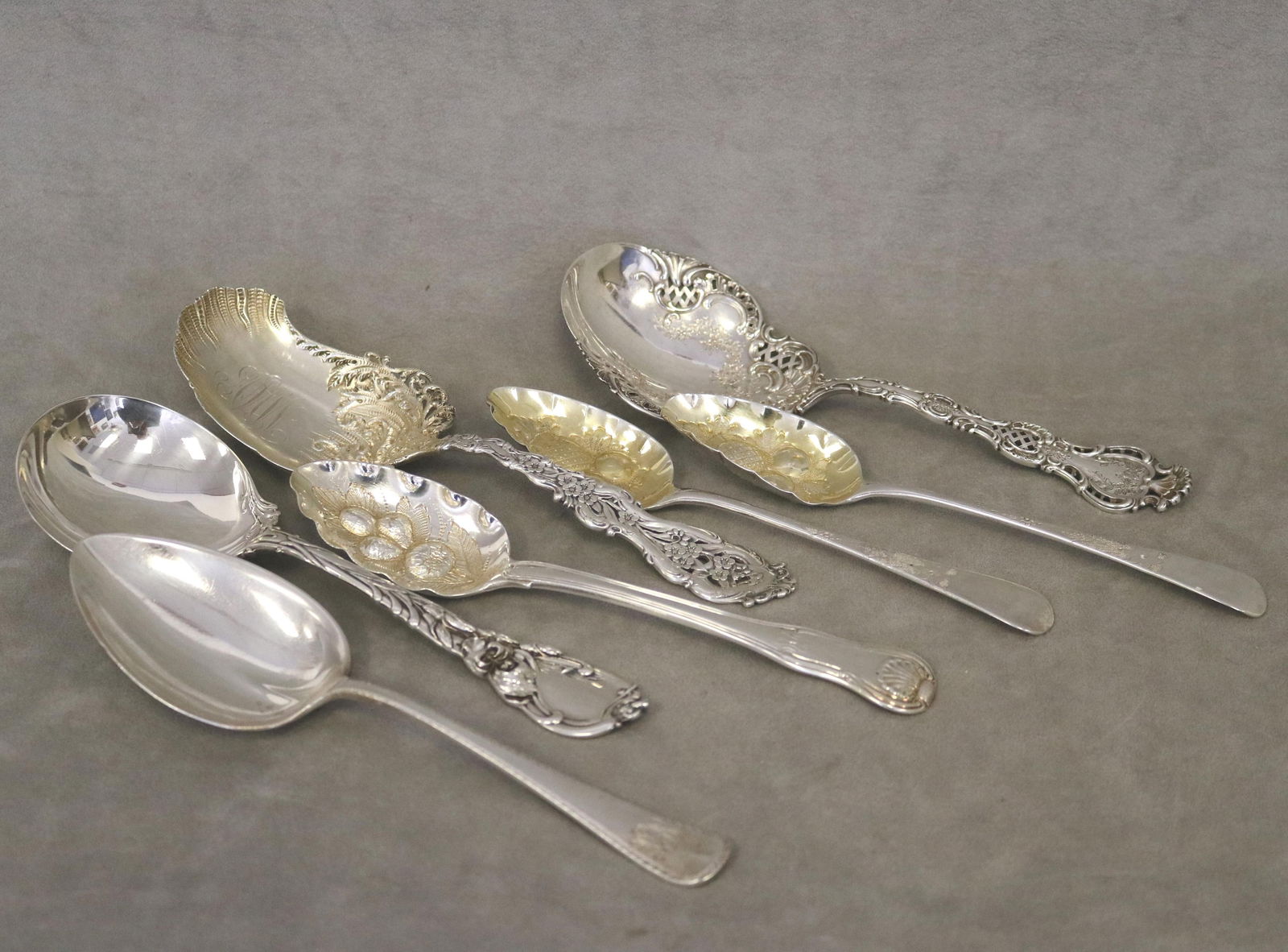 FOUR ASSORTED STERLING SILVER LARGE SERVING SPOONS, AND THREE GEORGIAN SILVER BERRY SPOONS late (1 of 20)