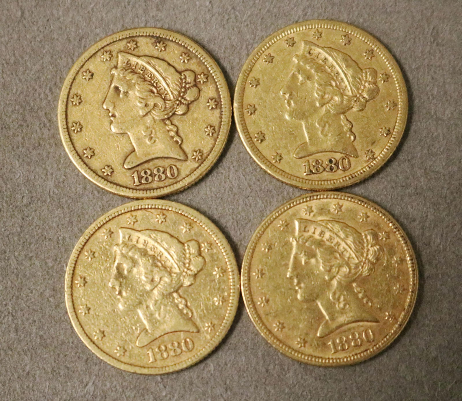FOUR U.S FIVE-DOLLAR GOLD COINS ALL DATED 1880 - .: FOUR U.S FIVE-DOLLAR GOLD COINS ALL DATED 1880