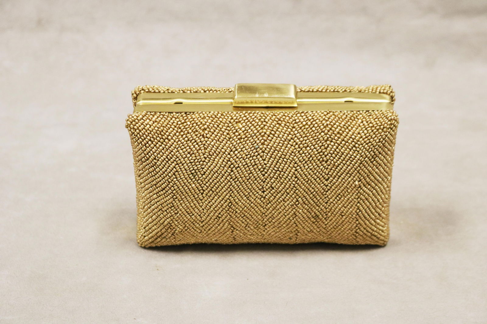 MOYNA COUTURE GOLD-TONE BOX-FORM BEADED CLUTCH OR EVENING BAG - .: MOYNA COUTURE GOLD-TONE BOX-FORM BEADED CLUTCH OR EVENING BAG Gold-tone frame and chain; gold-tone beads applied in all-over herringbone pattern; fabric-lined interior with pocket; Moyna Couture