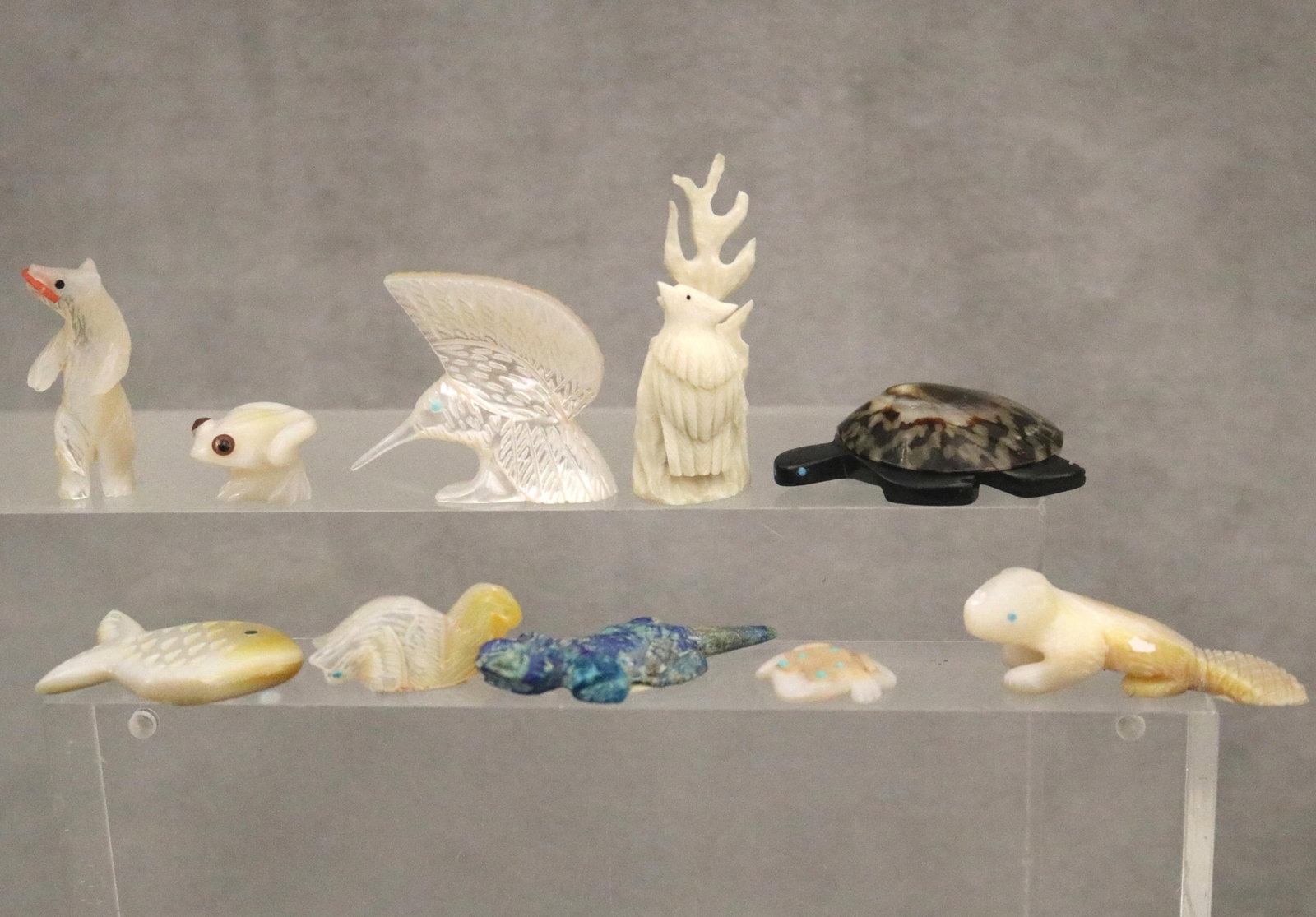 TEN ZUNI INTRICATELY CARVED MEDICINE FETISHES - Length of Dark Turtle 1.75 inches.: TEN ZUNI INTRICATELY CARVED MEDICINE FETISHES For over a millennium, the A:Shiwi (Zuni) have carved animal fetishes to honor the "medicine" or natural traits of wildlife, serving as focal points for p