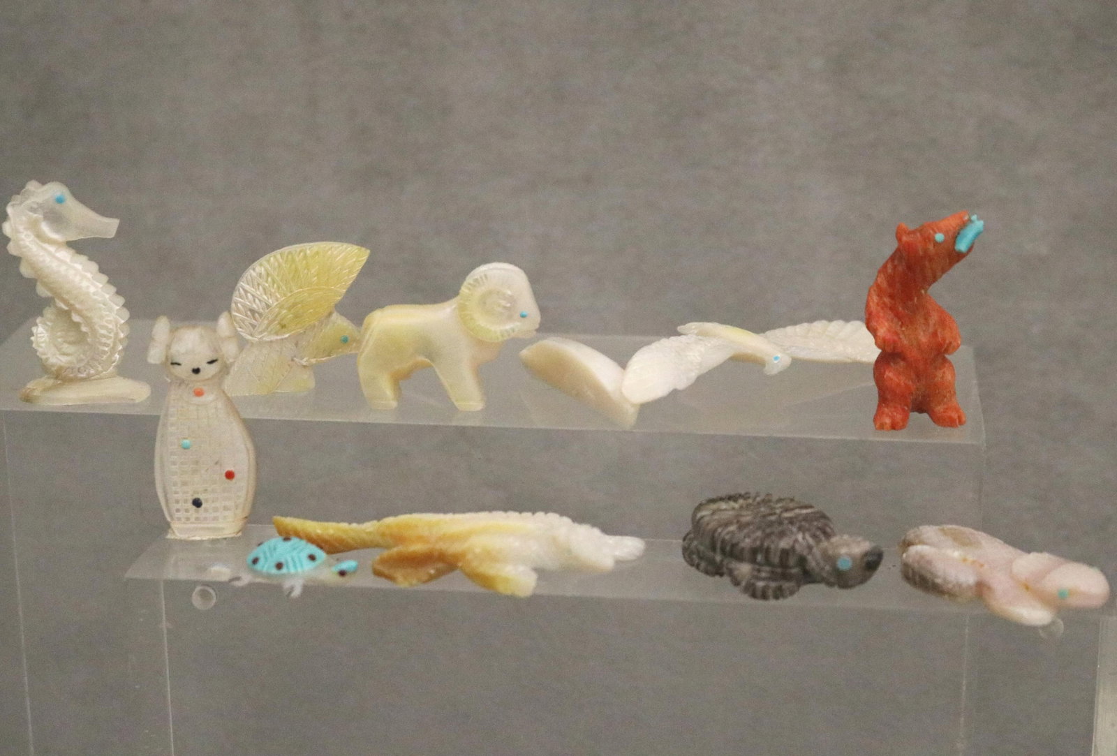 TEN ZUNI INTRICATELY CARVED MEDICINE FETISHES - Height of Coral Bear 1.5 inches.: TEN ZUNI INTRICATELY CARVED MEDICINE FETISHES For over a millennium, the A:Shiwi (Zuni) have carved animal fetishes to honor the "medicine" or natural traits of wildlife, serving as focal points for p