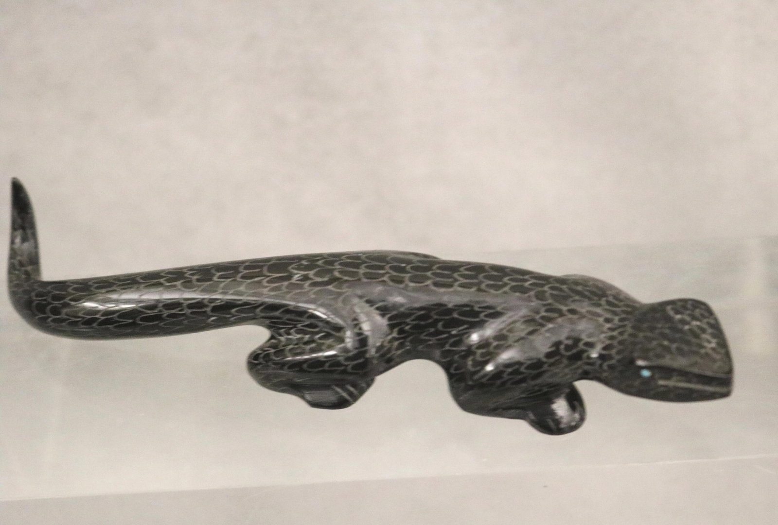 TWO ZUNI INTRICATELY CARVED MEDICINE FETISHES - Length of Black Salamander 5.5 inches.: TWO ZUNI INTRICATELY CARVED MEDICINE FETISHES For over a millennium, the A:Shiwi (Zuni) have carved animal fetishes to honor the "medicine" or natural traits of wildlife, serving as focal points for p
