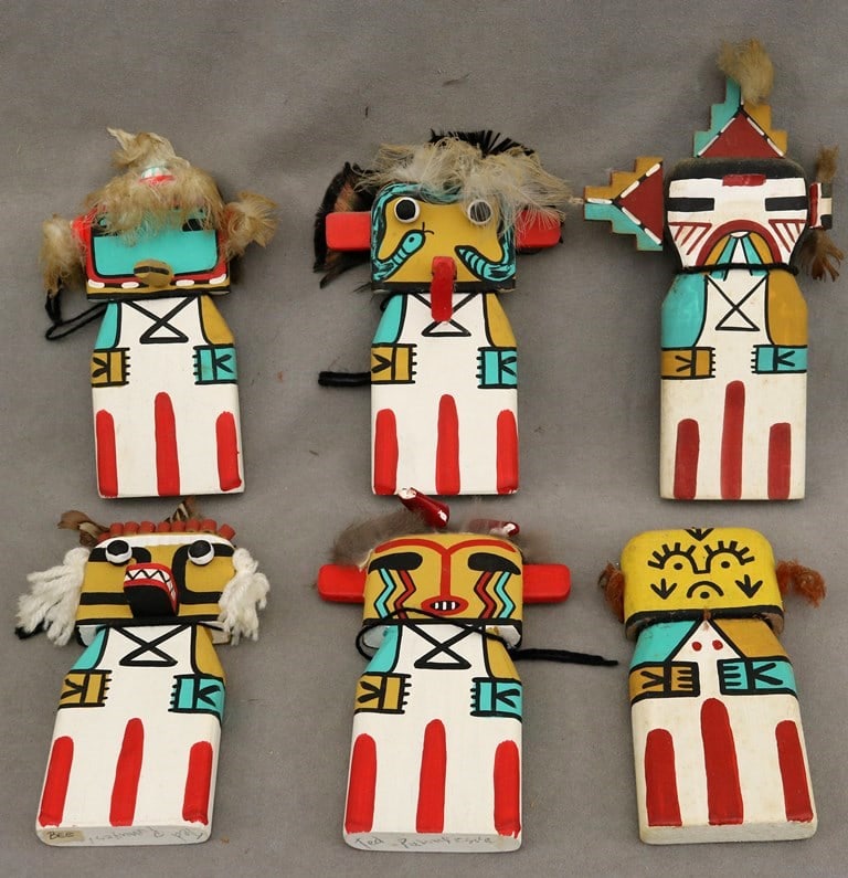 SIX SIGNED TED PUHUYESVA HOPI ARTIST SIGNED WUKOQOTE (BIG HEAD) CRADLE KACHINA DOLLS. - Height:: SIX SIGNED TED PUHUYESVA HOPI ARTIST SIGNED WUKOQOTE (BIG HEAD) CRADLE KACHINA DOLLS. Artist: TED PUHUYESVA. Six painted wooden Kachina dolls (or Katsina dolls) which are traditional ceremonial objec