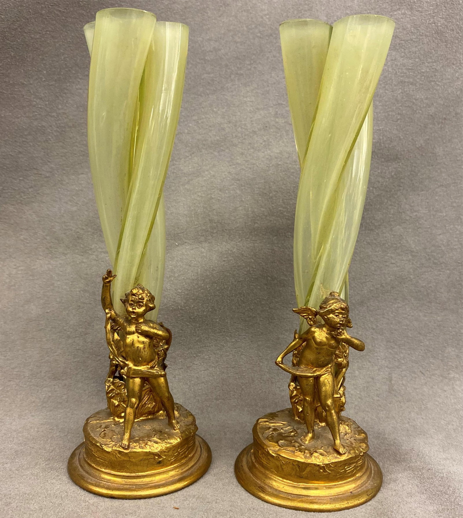PAIR FRENCH GILT BRONZE AND GREEN TRANSLUCENT ART GLASS CORNET VASES - H: 7 1/2 in..: PAIR FRENCH GILT BRONZE AND GREEN TRANSLUCENT ART GLASS CORNET VASES Figural cast bases H: 7 1/2 in.