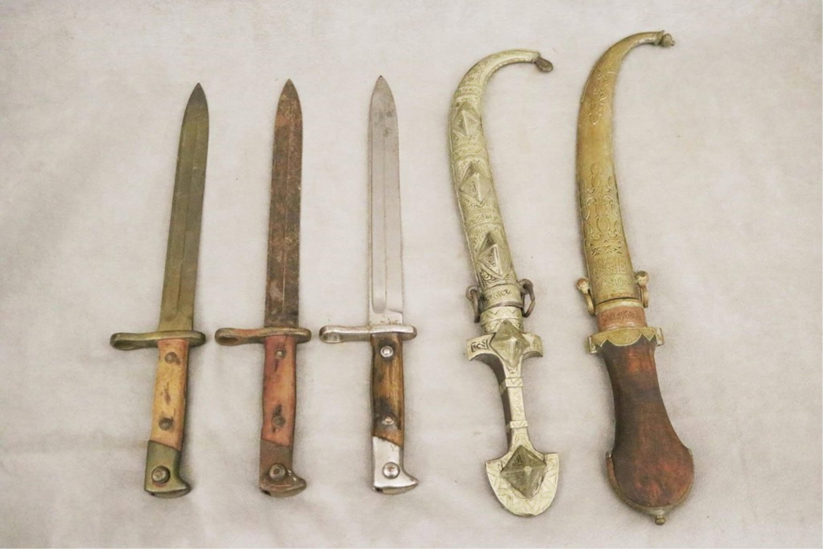 FIVE MILITARY BAYONETS AND DECORATIVE CEREMONIAL DAGGERS - . (1 of 13)